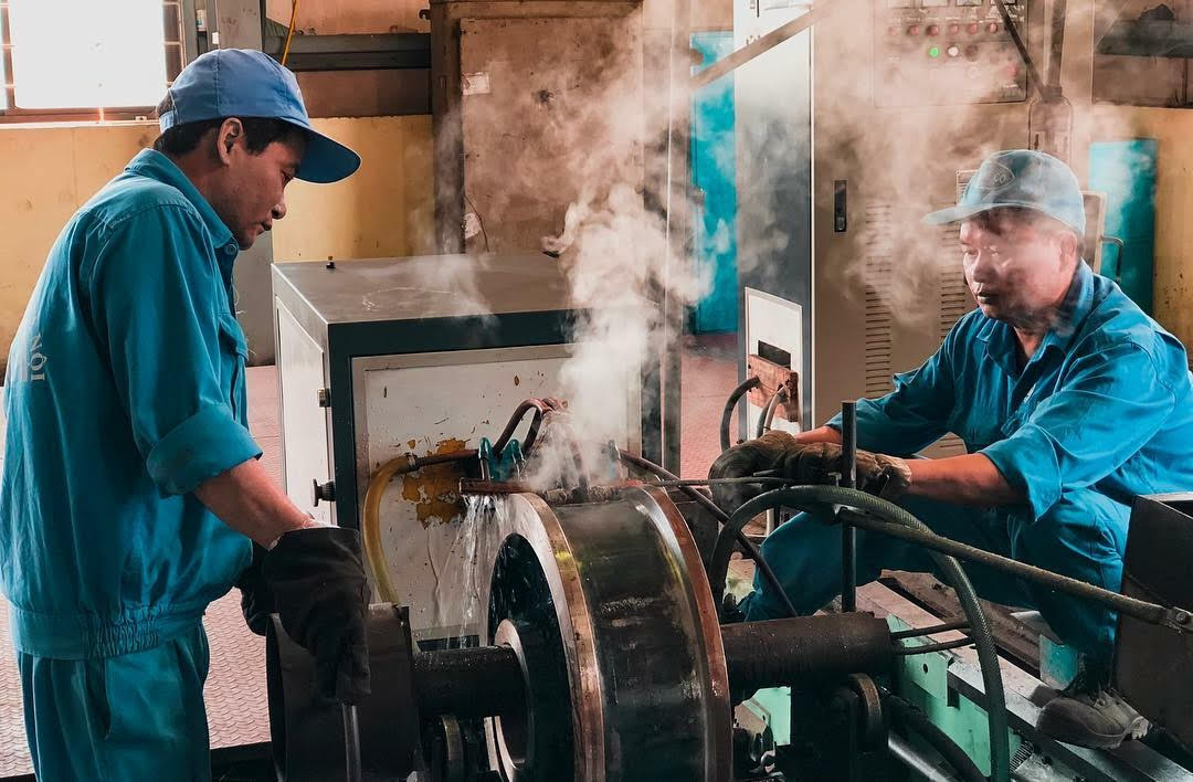 Engineers reviewing a production part at the Monterrey workshop